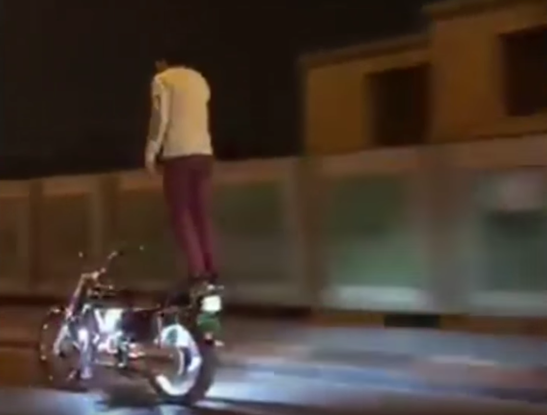 Video: Rider stands on moving motorcycle at high speed | Visordown